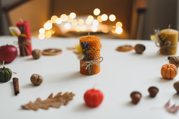 Autumn still life with candles. Hygge lifestyle, cozy home decor. Happy Thanksgiving, Halloween background. Flat lay, top view