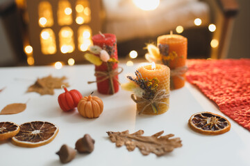 Obraz na płótnie Canvas Autumn still life with candles. Hygge lifestyle, cozy home decor. Happy Thanksgiving, Halloween background. Flat lay, top view