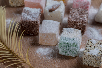 Oriental sweets on a wooden plate.