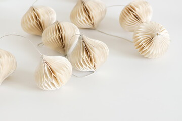 paper garland home decoration  close up. Beige color. Poster