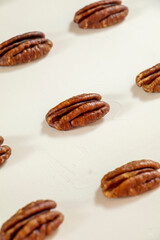 peeled pecan kernels lying on the table lines