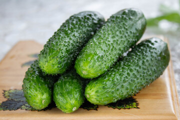 cucumbers on a wooden board