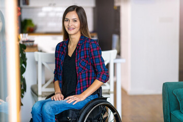 Young Woman In Wheelchair In Her Home 
