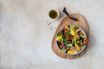Salad with grilled vegetables, cherry tomatoes and pita