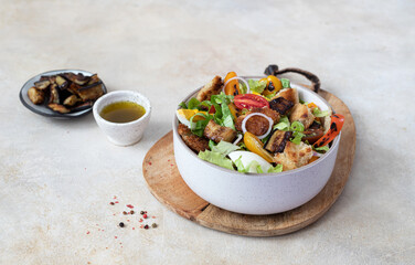 Salad with grilled vegetables, cherry tomatoes and pita