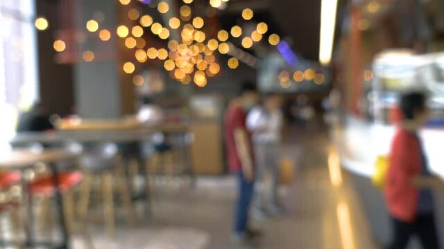 Blurred background of a food court or food center at shopping in Bangkok, Thailand.