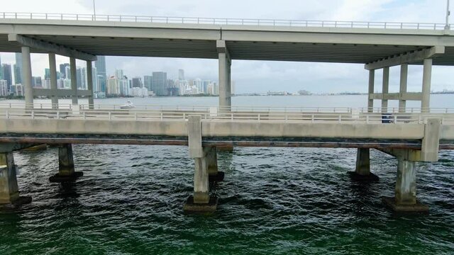 Aerial view close to the William M Powell Bridge to Key Biscayne, cloudy day, in Miami, Florida, USA - tracking, drone shot