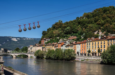 Fototapeta na wymiar Gondolas of Grenoble View from Isere River