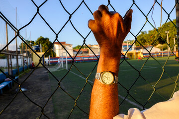 hand on the fence