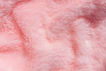 Pink fur texture top view. Coral fluffy fabric coat background. Winter fashion color trends feminine flat lay, female blog backdrop for text signs desidgn. Girly abstract wallpaper, textile surface.