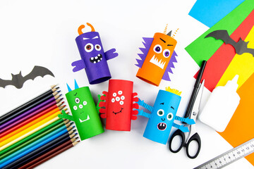 Halloween decoration. DIY and kids creativity concept. Step by step instructions: make a monster from a roll of colored paper toilet paper. Step 11 is the finished result. © nadezhda