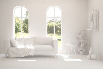 Fototapeta premium White living room with sofa and summer landscape in window. Scandinavian interior design. 3D illustration
