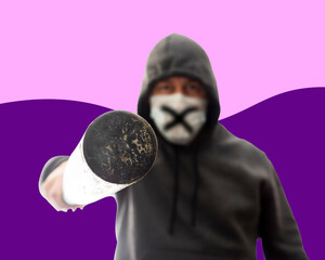 Hooligan in mask and hoodie pokes in face with baseball bat, isolated on colored