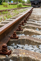 Closeup of rails and bolts parts of old railway