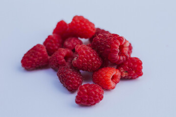 raspberries on a white background