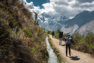 Fototapeta na wymiar Tourists hiking on the way to machu picchu by the salkantay trek, Peru