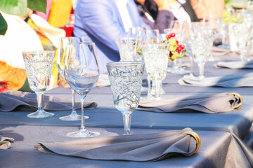 Restaurant serving beautiful table, glasses of napkins, vacationing people