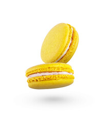 Lemon yellow macaroons fly on a white background. Beautiful yellow macaroons
