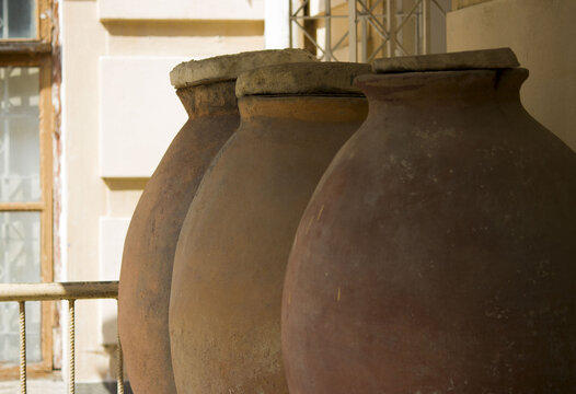large ancient pithos clay vessels for storing wine, cereals and other products. vertical photo. south of Russia