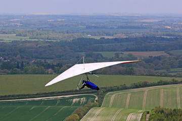 Obraz na płótnie Canvas Hang Glider flying at Combe Gibbet, England