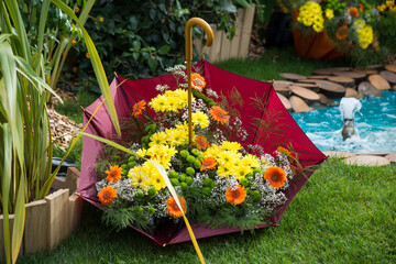 Closeup of colorful flowers in umbrella in a public garden