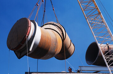 Installing fume extraction pipe into steel foundry smelter