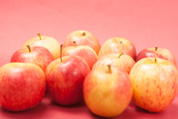 apples on a red background