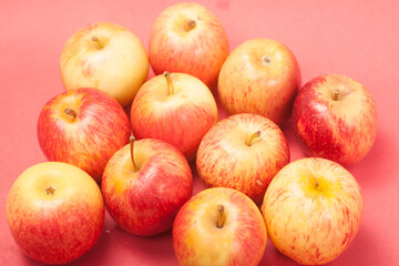 apples on a red background