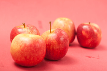 apples on a red background