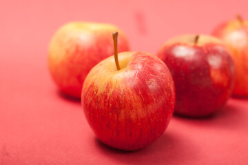 apples on a red background