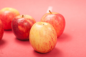 apples on a red background