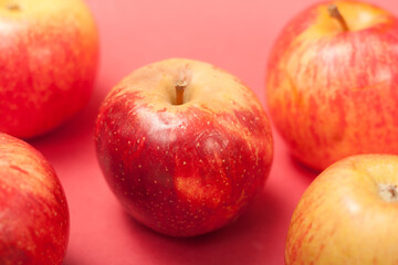 apples on a red background