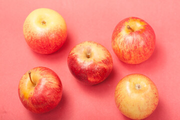 apples on a red background