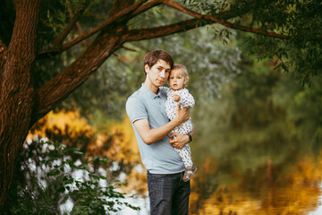 Fototapeta premium happy family father and son walking in nature