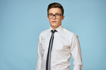 Business man white shirt tie glasses self-confidence official blue background