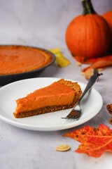 Homemade Pumpkin pie served in a dessert plate, selective focus / Thanksgiving dessert