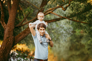 Obraz premium happy family father and son walking in nature