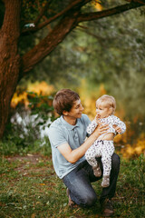 Fototapeta premium happy family father and son walking in nature
