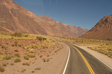 Fototapeta na wymiar Driving and hiking in the Andes Mountains between Chile and Argentina on the way to Mendoza
