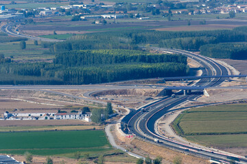 aerial view of highway in the mountains