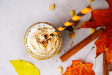 Homemade Pumpkin spice Smoothie /Latte on fall autumn background, selective focus