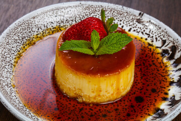 Panna cota with syrope and strawberry