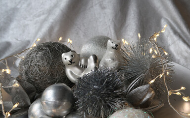 Naklejka na ściany i meble silver grey metallic christmas decoration closeup with two relaxed icebear figurines