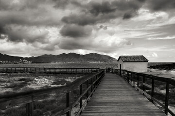 Wooden boardwalk along the beach in Isla Plana village