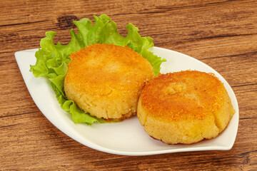 Vegan cuisine - Potato cutlet in the plate