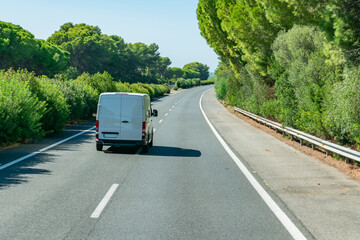 Express parcel delivery van driving on the highway