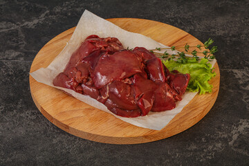 Raw chicken liver over board