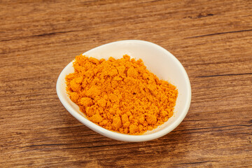 Tumeric powder in the bowl