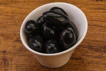 Pickled black olives in the bowl