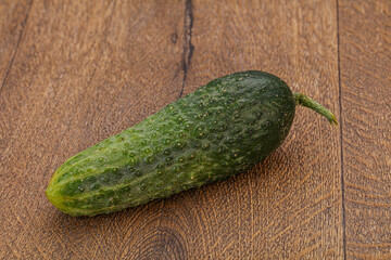 Green ripe fresh cucumber over background